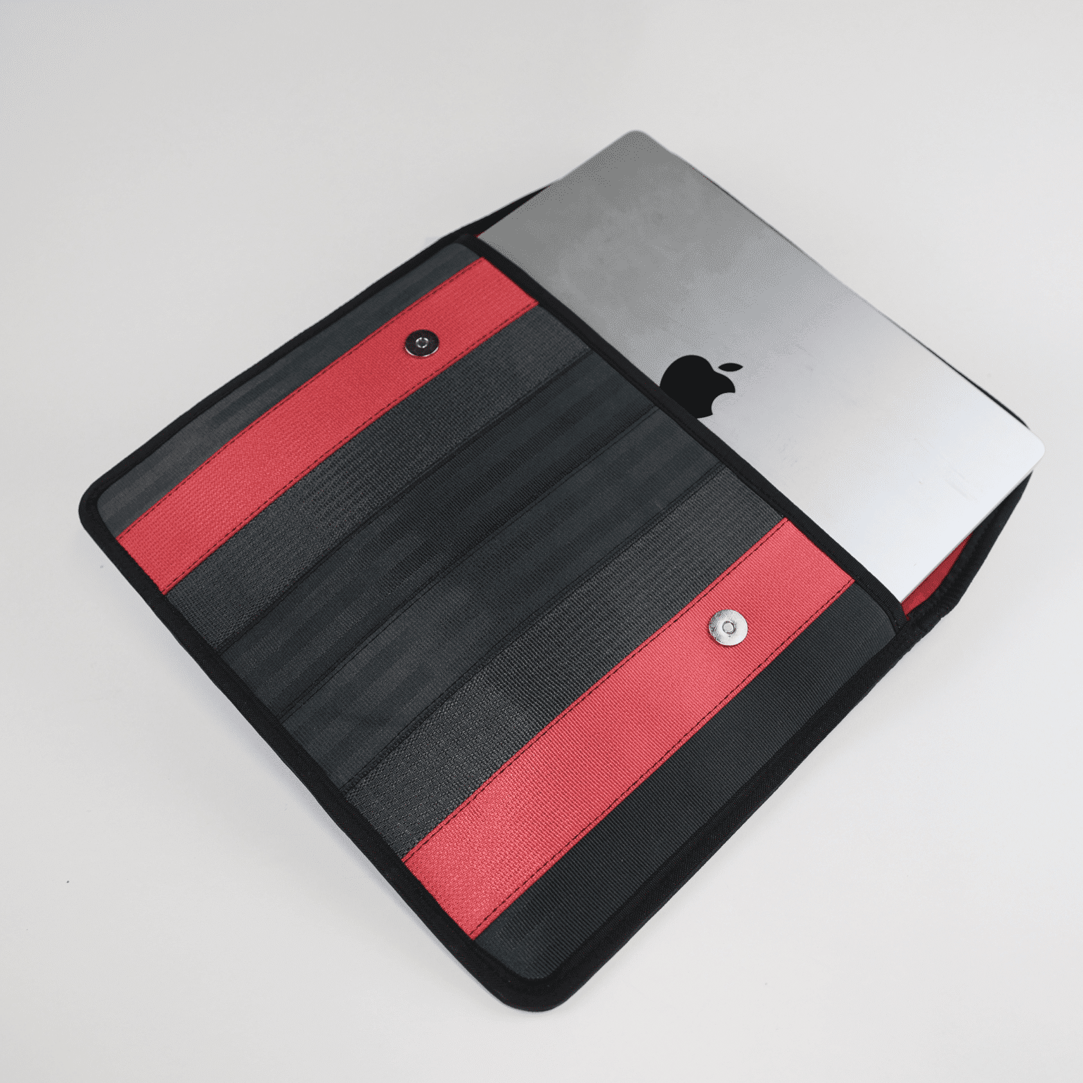 jaggery upcycled laptop sleeve with computer corporate gift idea of a laptop sleeve made from upcycled seat belts in read and black