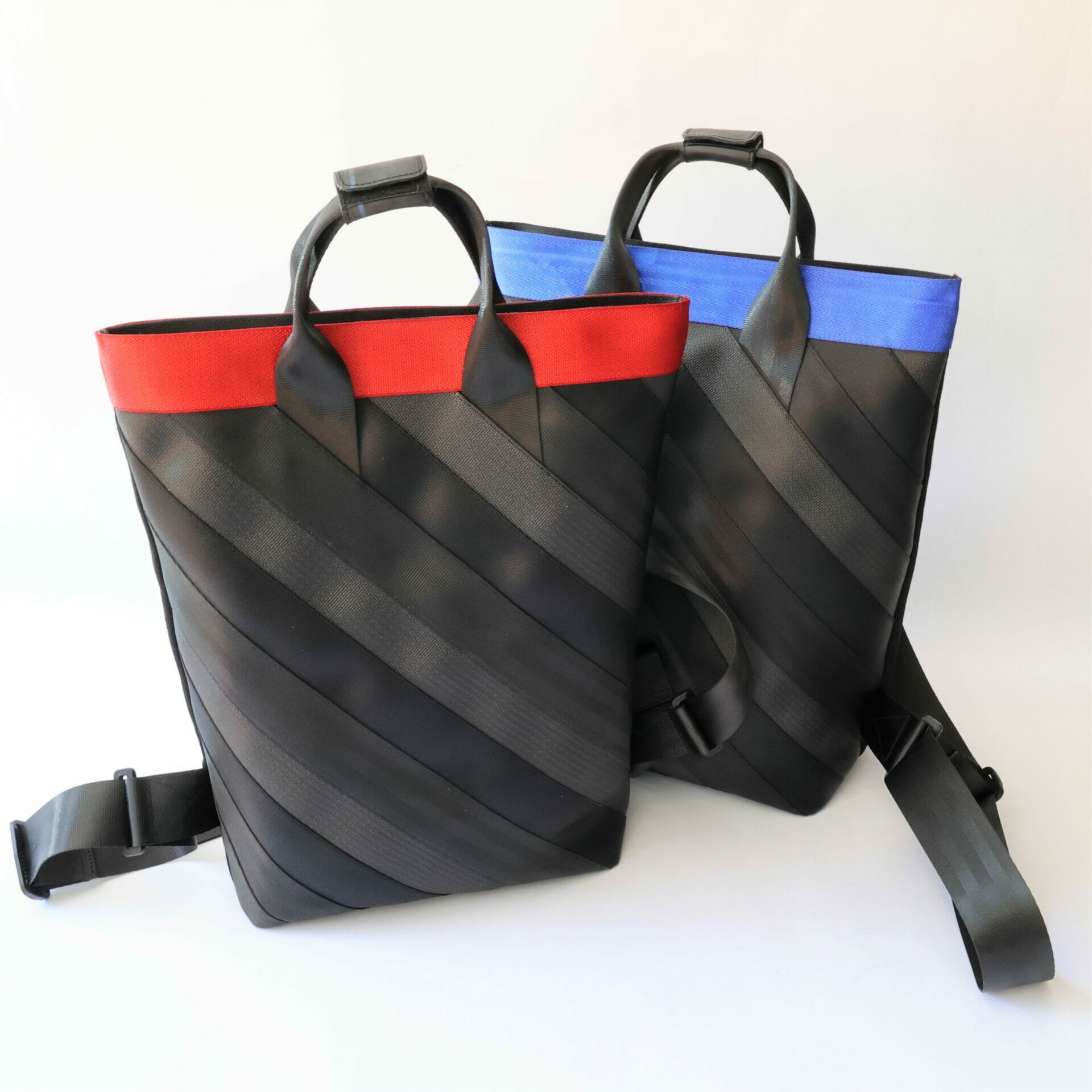 Blue and Red Backpacks Two black upcycled backpacks, one with a red stripe, the other with blue