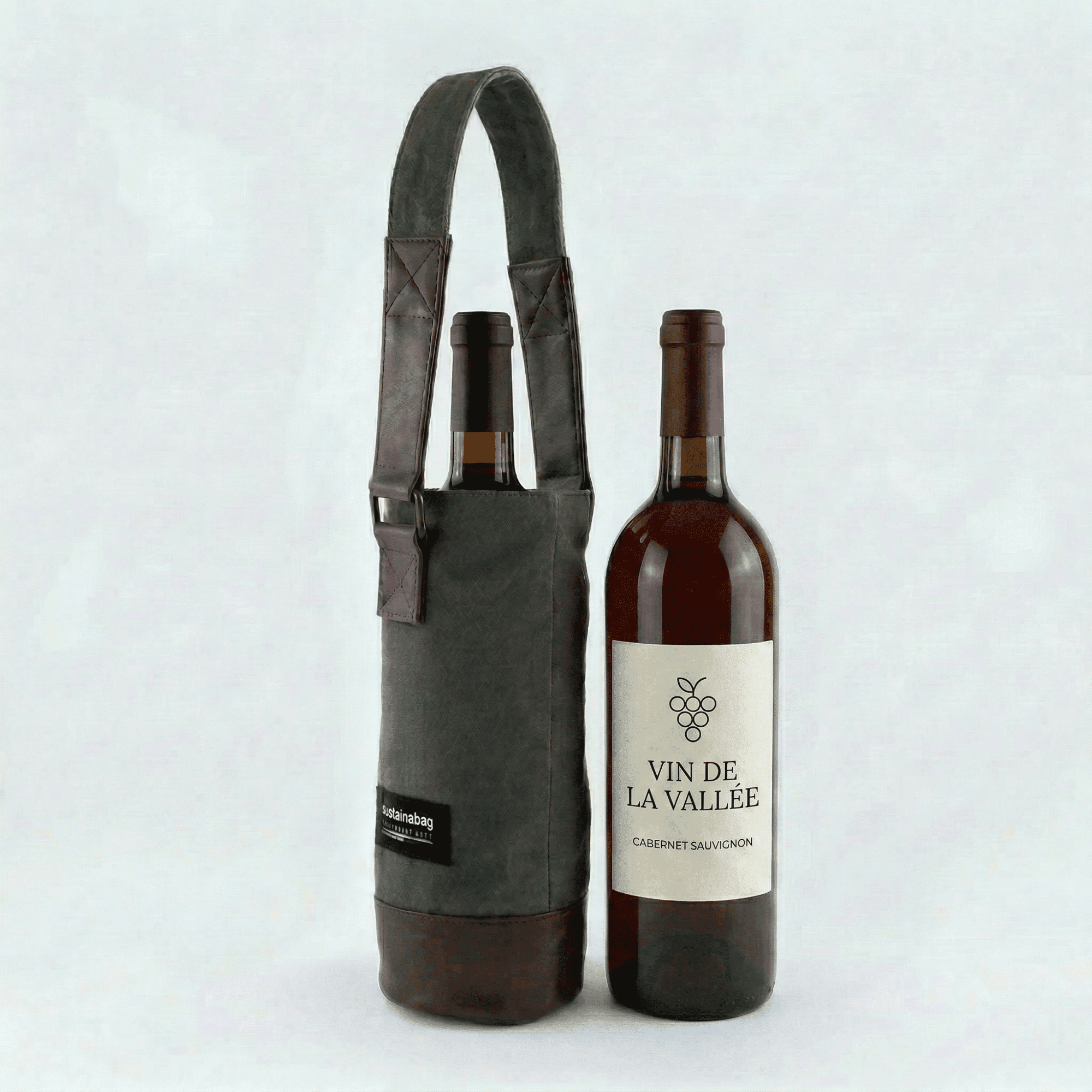 Jaggery Reimagined Wine Tote A wine bottle tote with a bottle of wine inside of it and a bottle of wine next to it