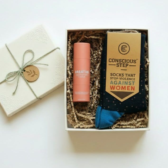 A simple moment gift box A pair of socks that prevent violence against women and an essential oil roll on made by women survivors - A unique gift for International Women's Day