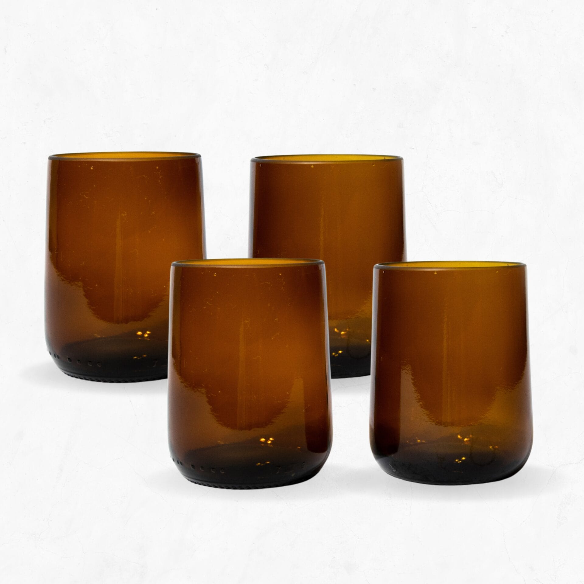 4 simple amber gronn glasses straight on 4 simple upcycled amber glasses made from Modelo beer bottles photographed straight on
