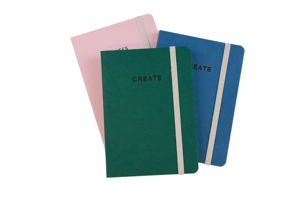 Create Notebooks NoBackground (1) Solid color notebooks with "Create" embossed on cover