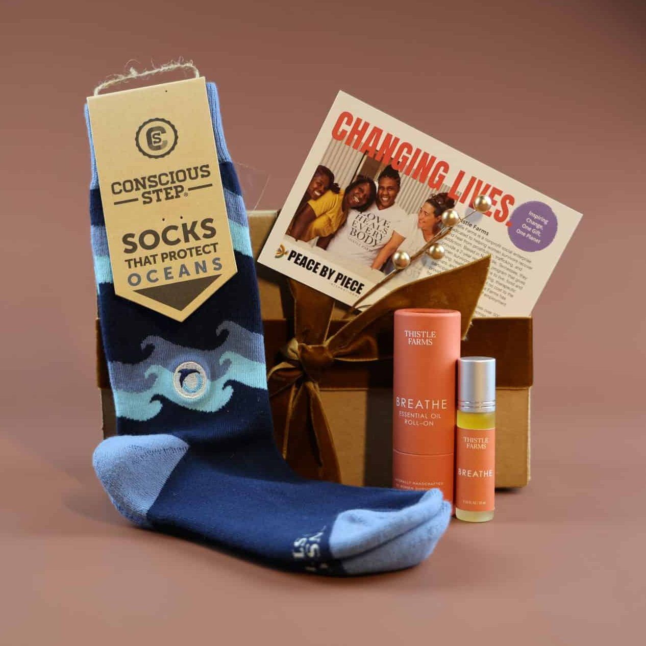 A Simple Moment Gift Box Blue and Orange socks and essential oils for a corporate holiday gift
