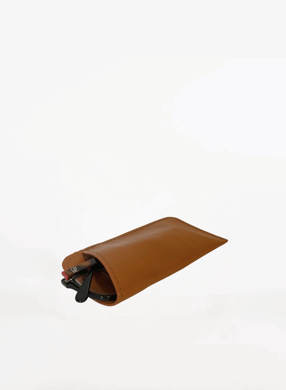 deux main sunglasses case in cognac with glasses a corporate gift photo of a brown leather sunglasses case with sunglasses inside