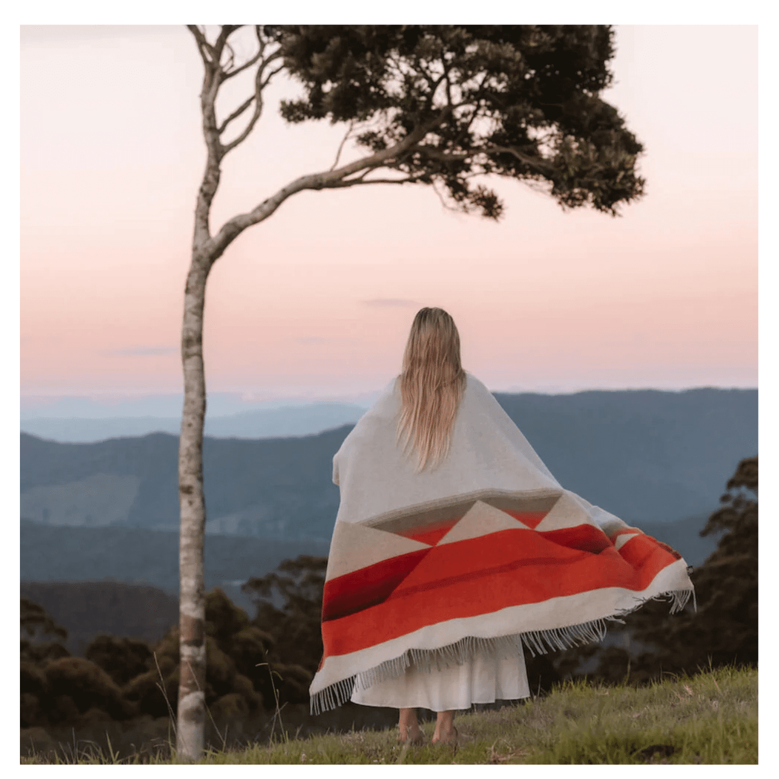 model with mountain blanket model with the blanket around her. An ideal premium corporate holiday gift.