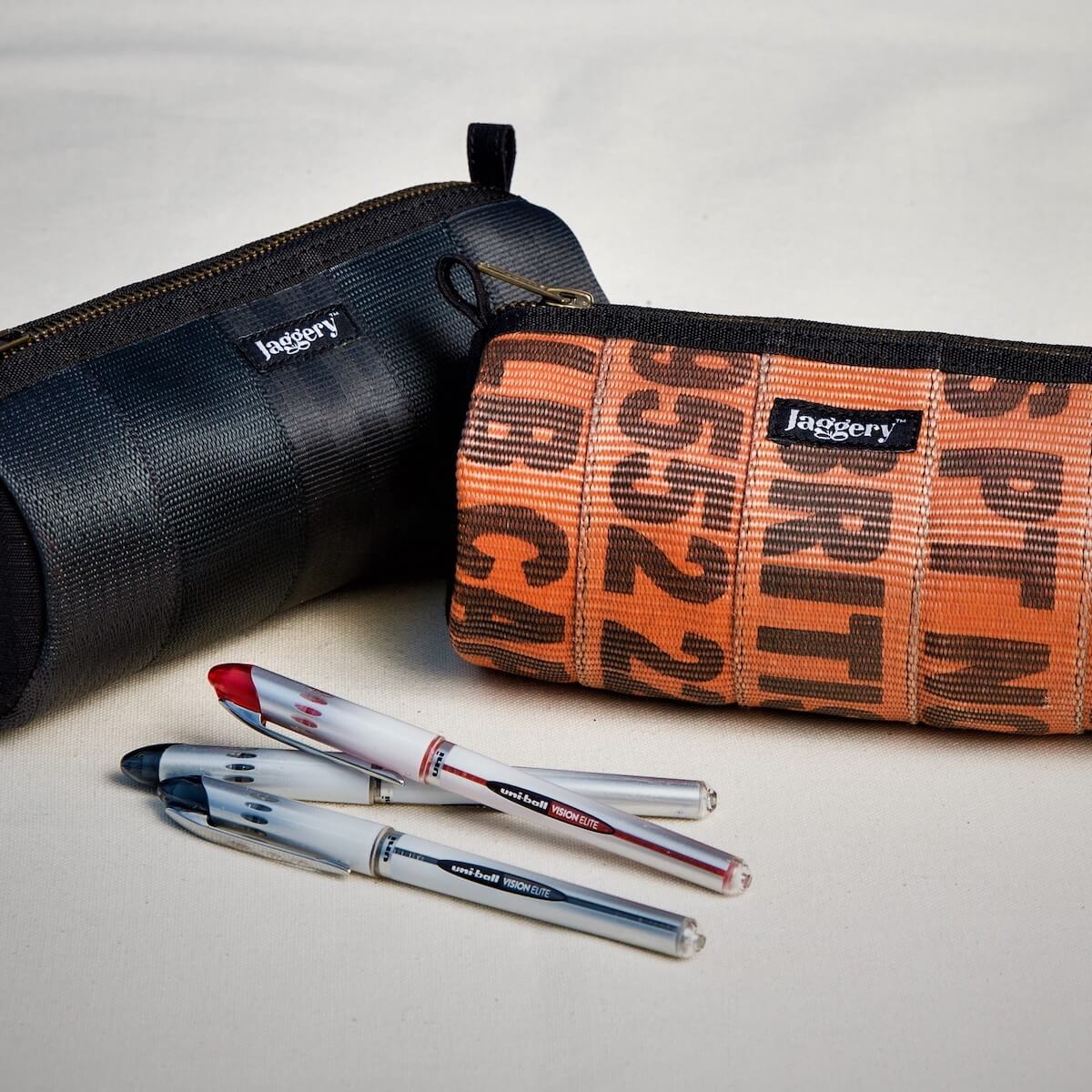 1 orange 1 black tube pouch with pens 1 orange 1 black tube pouch with pens