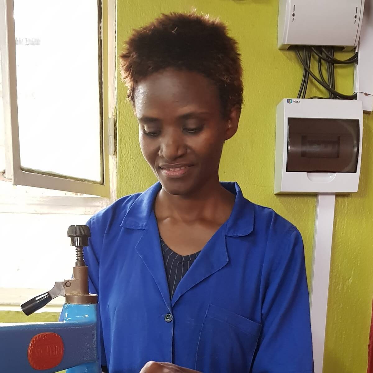 women with short hair and blue smock women with short hair and blue smock
