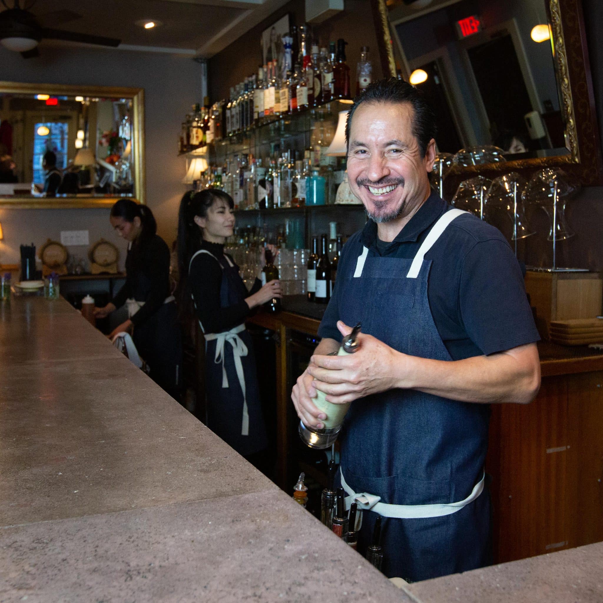 Flea Street Aprons behind bar corporate gift aprons in action behind the bar