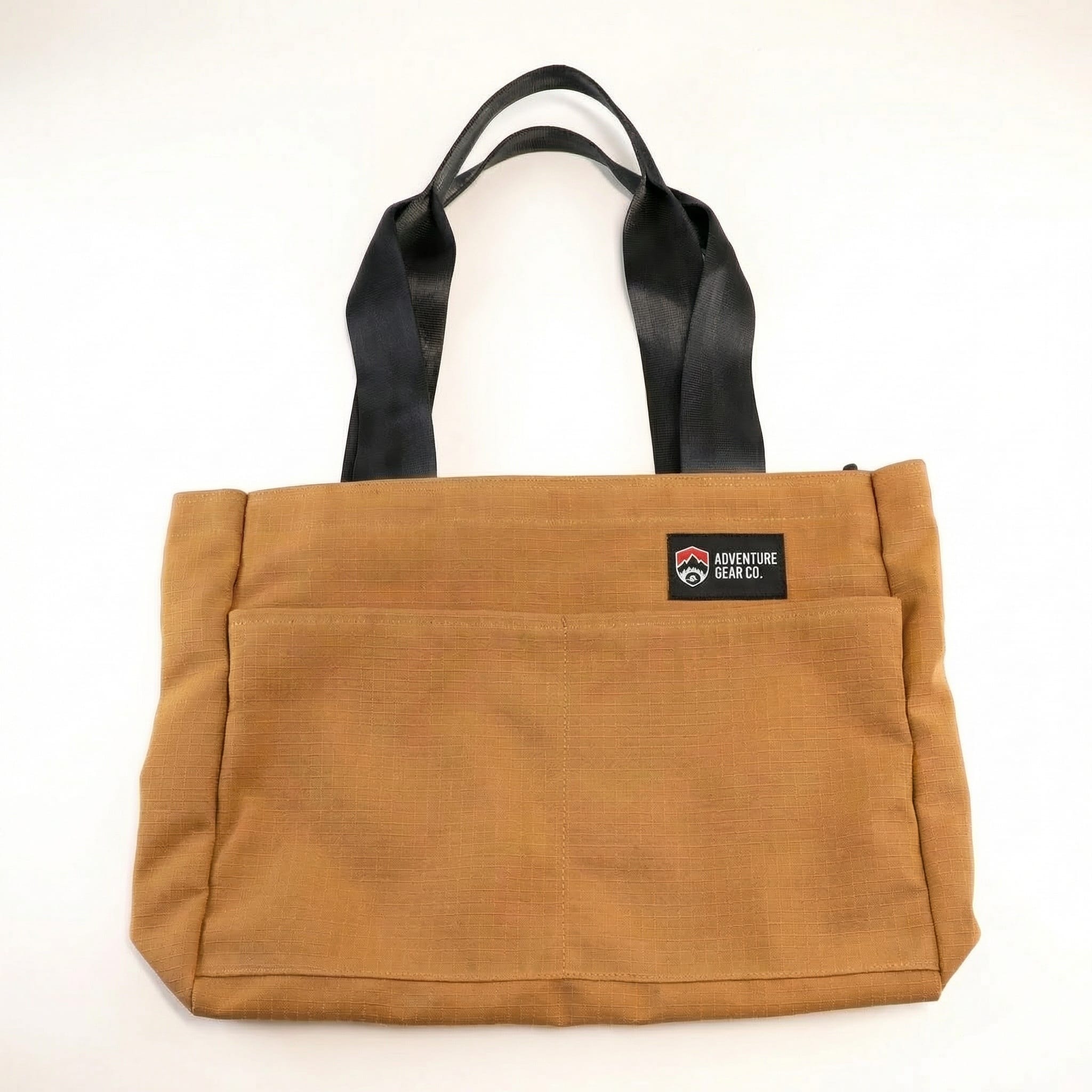 Jaggery Sidekick Tote in gold A gold brandable tote back with black handles made from upcycled seat belts