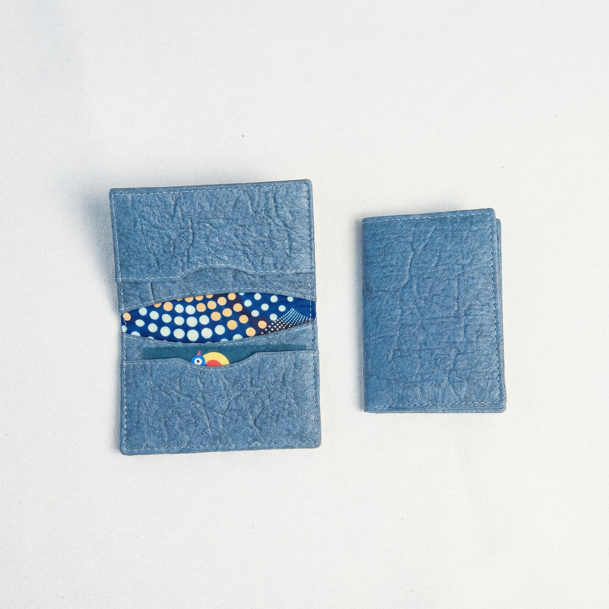Dokmai Piñatex Card Holder a card holder made from Piñatex Vegan Leather laid out in both an open and a closed position