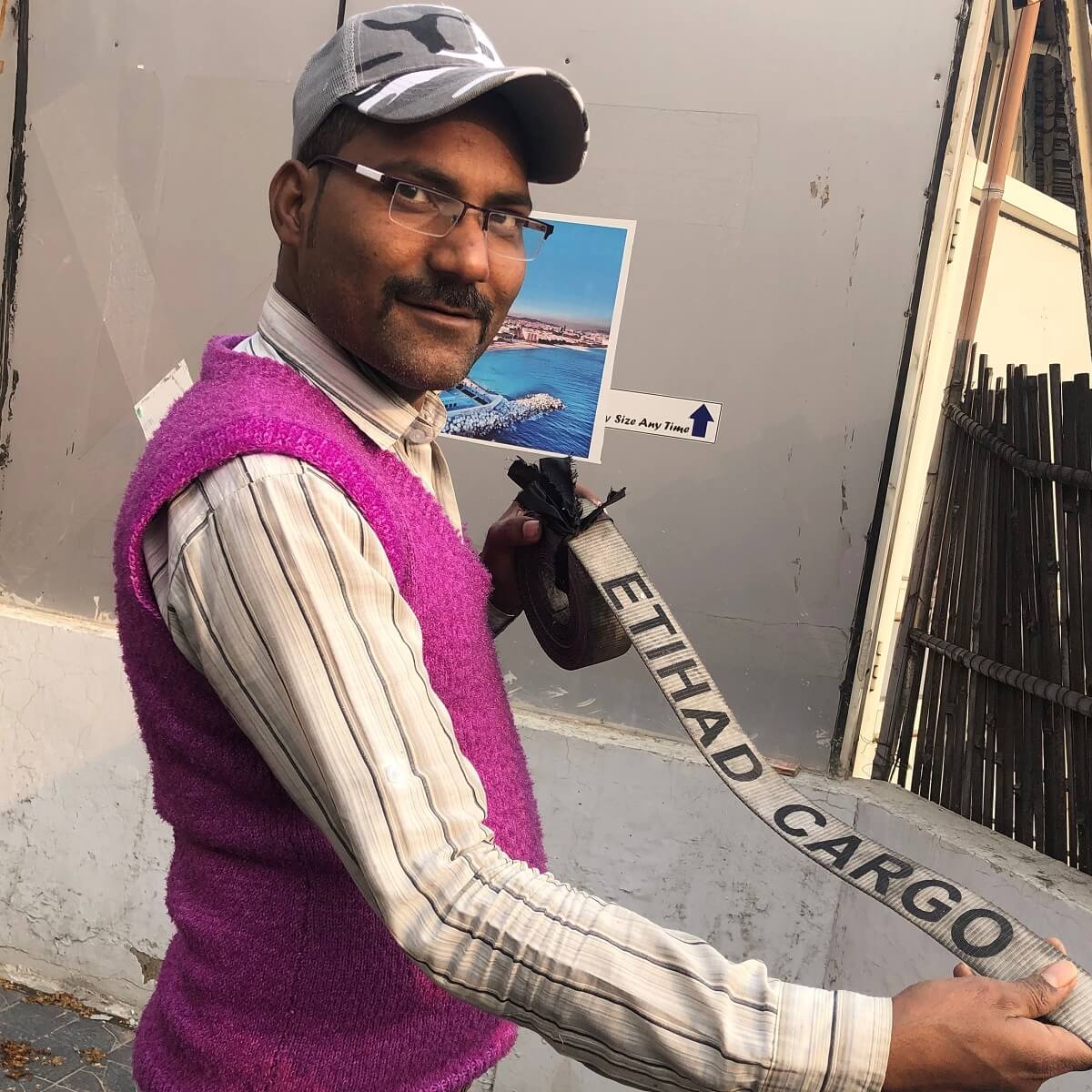 man in pink vest with belt man in pink vest with belt