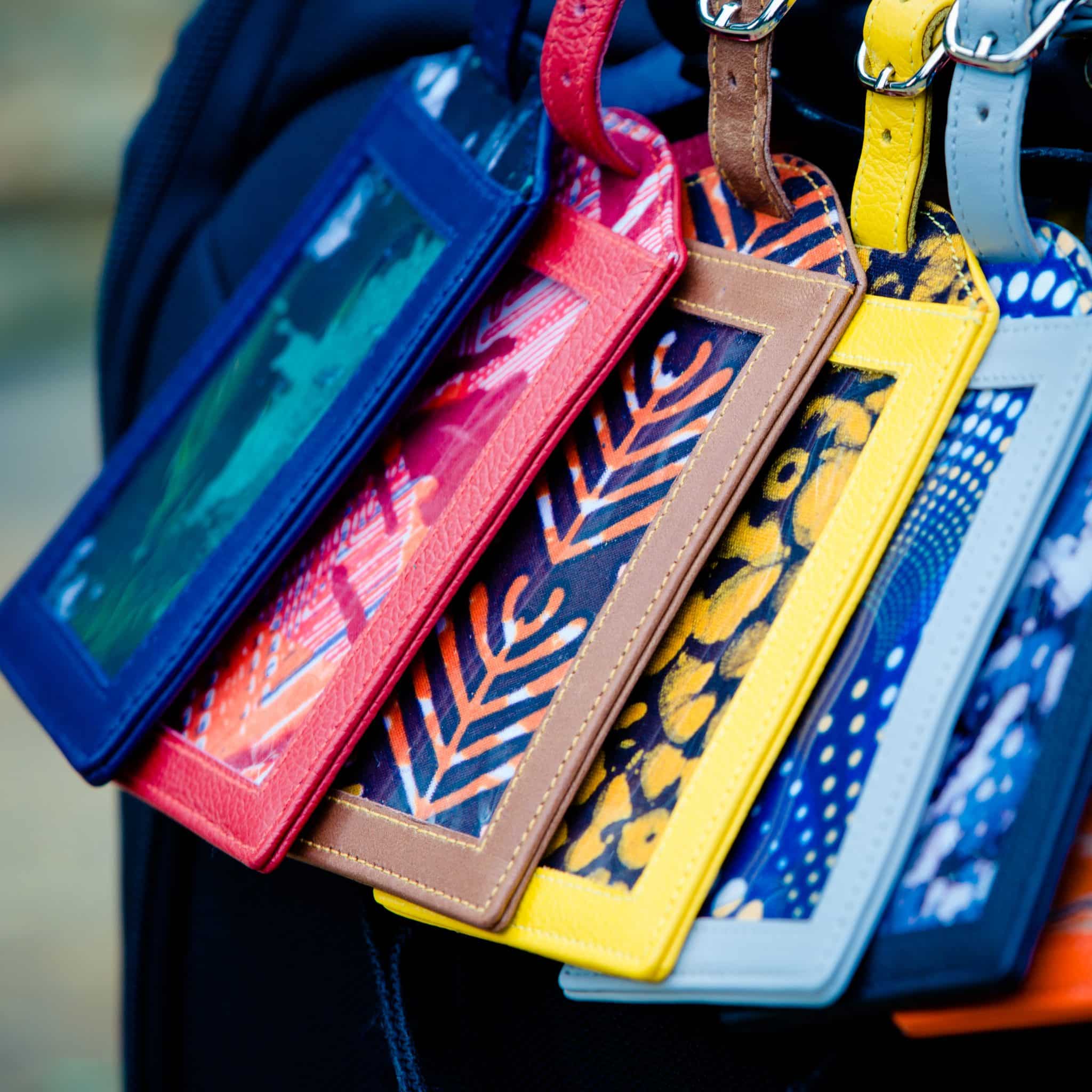 Row of multicolored luggage tags close up Row of multicolored luggage tags close up