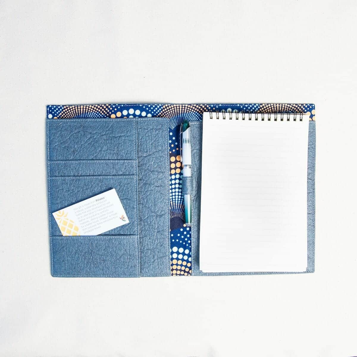 open blue portfolio Open blue portfolio crafted from vegan leather, showcasing its interior