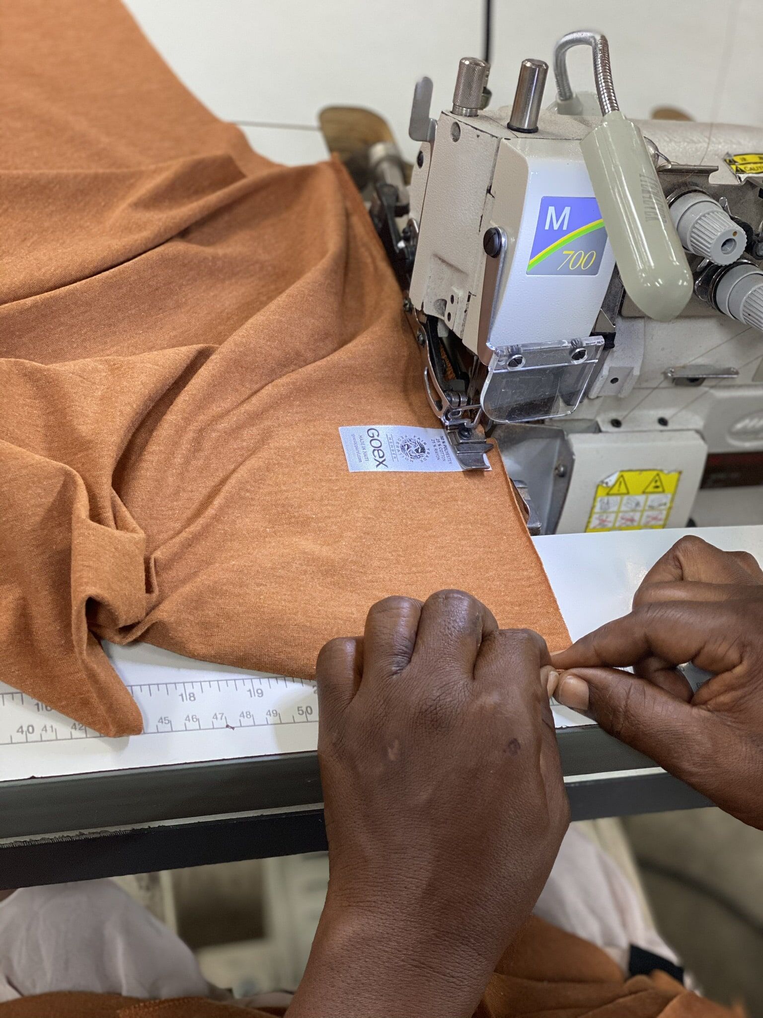 GOEX BTS 1 hands making t-shirts for corporate gifts