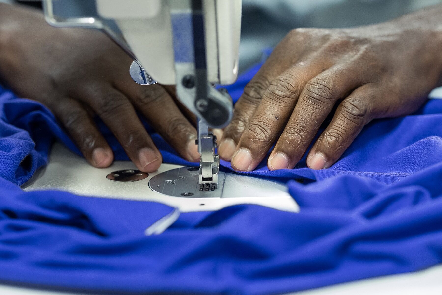 GOEX BTS 2 hands making t-shirts for corporate gifts